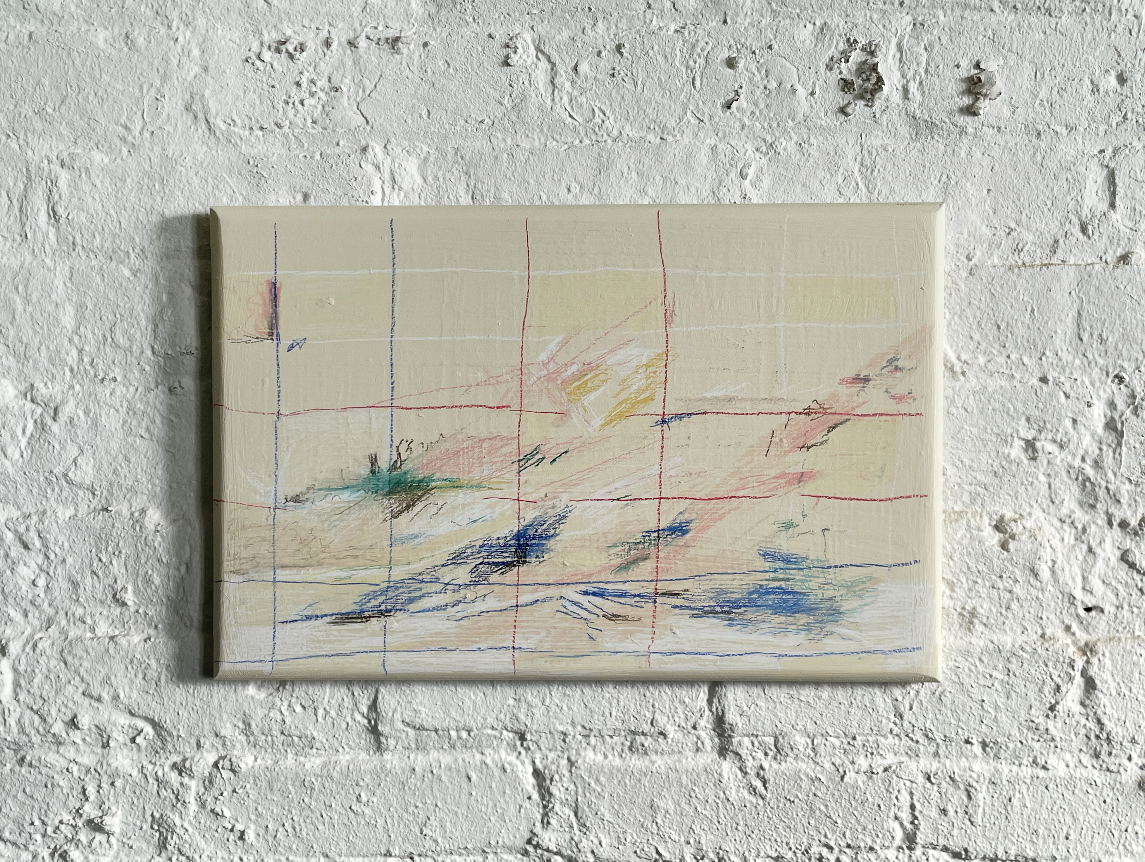 photograph of a painting with a grid drawn in blue red and white pastels with colorful fields threading through