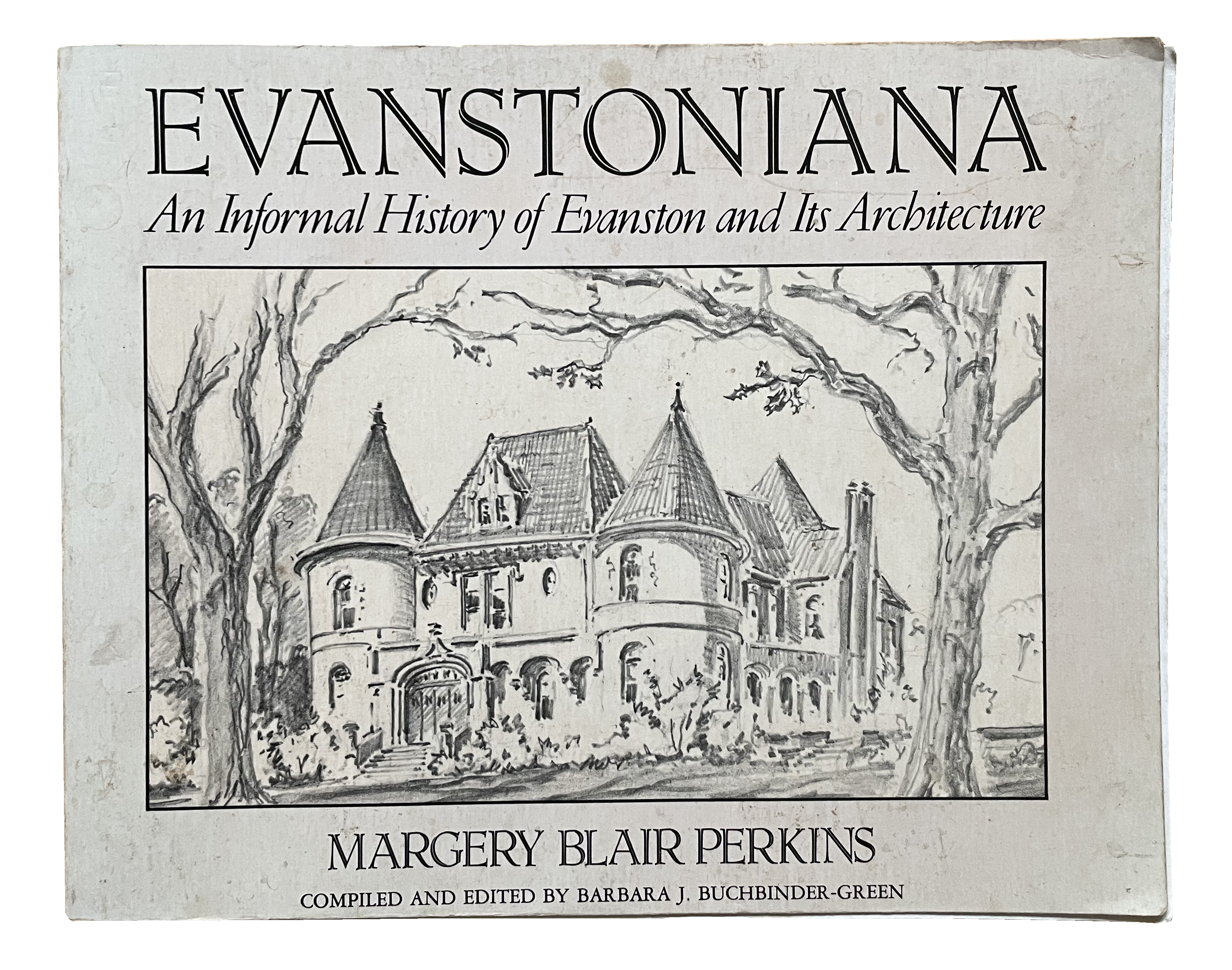 a photo of a book cover reading "EVANSTONIANA, An Informal History of Evanston and its Architecture." There is a drawing on the front of a house framed by two trees